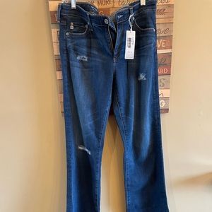 AG NWT boot leg jeans with some distressing.